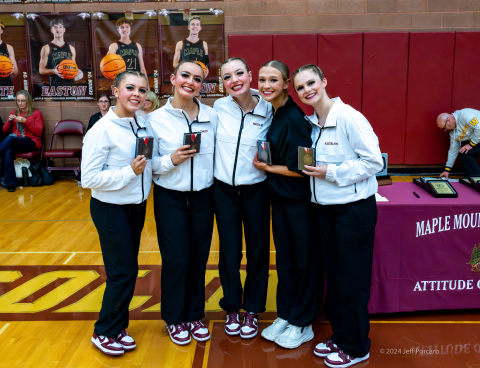 Group of 5 girls with trophies