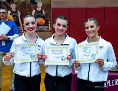 3 girls with certificates