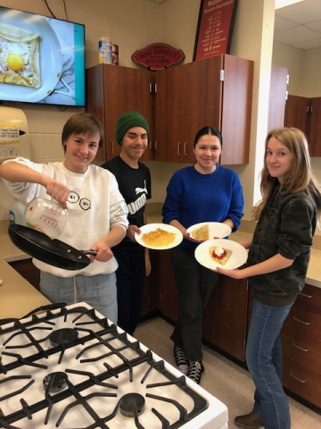 students posing with food