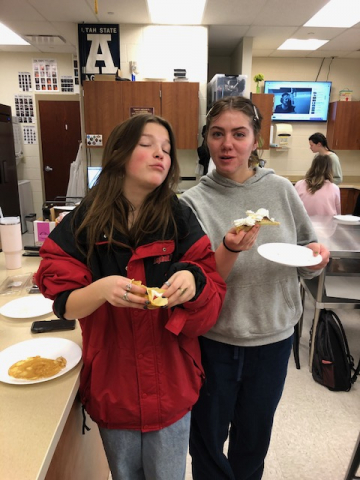 students posing with food